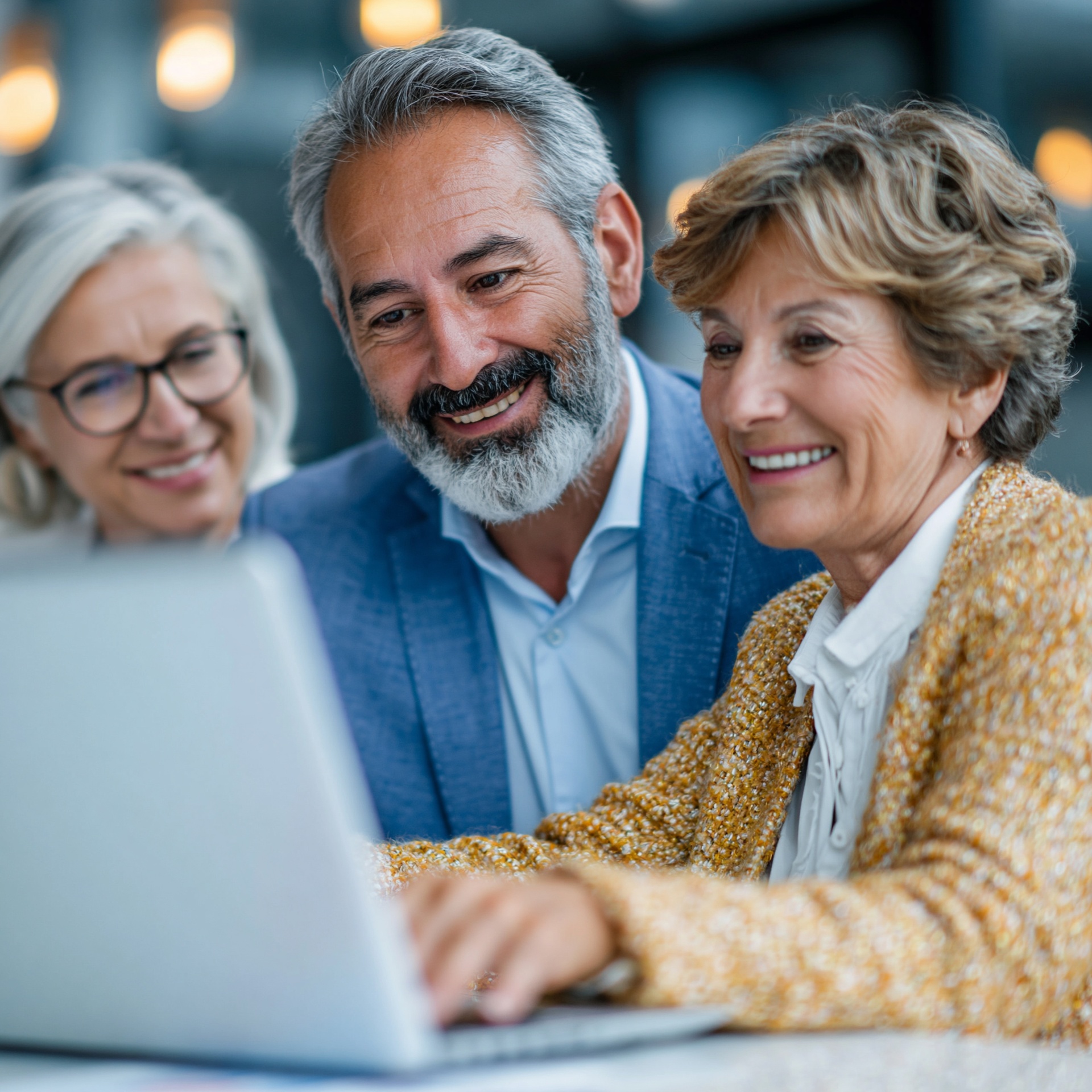 Senior woman and specialist reviewing technology together