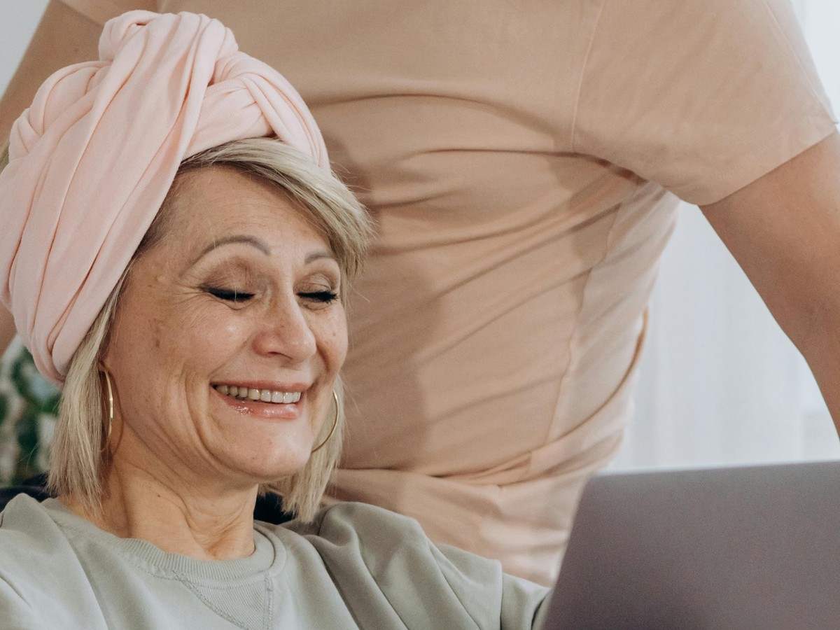 Friendly support specialist smiling on a call